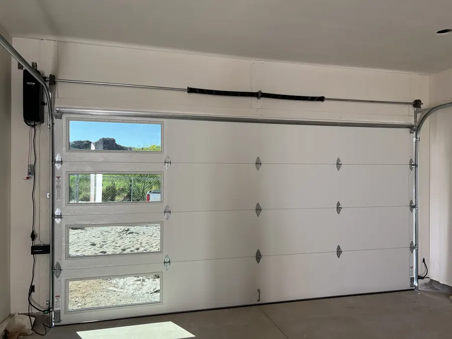 Finished garage door installation with window panels